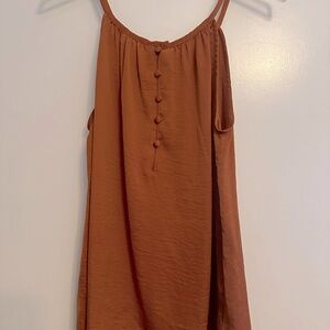 Camisole blouse with loose fit. It is more copper color than orange